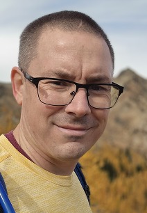 Headshot of a person outdoors