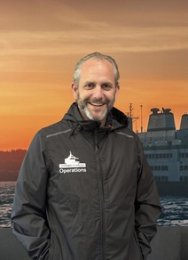 Dirk van der Raadt poses for a photo in a WSF Operations jacket