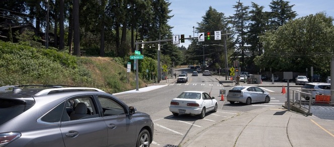 Rendering of Fauntleroy Avenue Southwest intersection showing traffic lights and multiple cars, surrounded by trees.