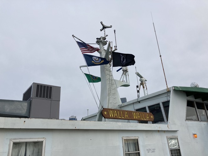Four flags fly on ferry Walla Walla, including the American, POW/MIA, U.S. Navy and Washington state flags.