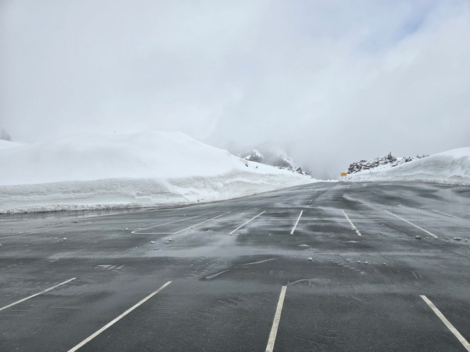 Clouds hover above the cleared parking lot at Artist Point after the final 2.7 miles of SR 542/Mount Baker Highway opened Wednesday, June 10.