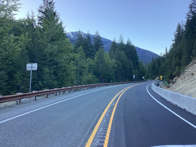 A recently repaired section of State Route 20/North Cascades Highway in a mountainous area.
