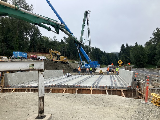 Construction sight with crews and machinery building a bridge along southbound I-5 south of Bellingham.