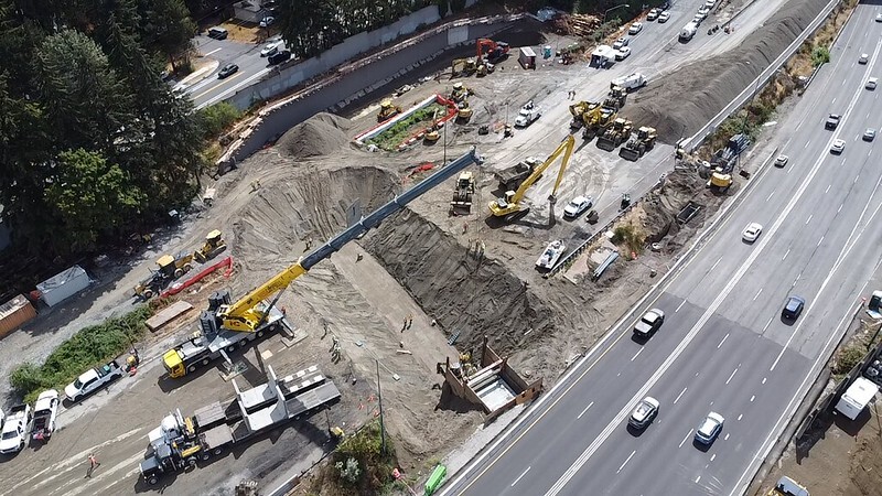 Aerial view of crews digging a trench for a new fish culvert under northbound I-405 on Saturday, Aug. 29.