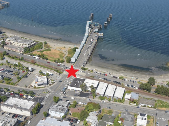 Aerial view of a Edmonds waterfront with a large red star marking the railroad crossing right in front of the ferry terminal.