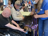 Residents of Walla Walla Veterans Home petting ponies