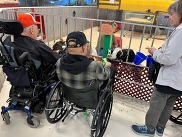 Veterans with animals at a petting zoo