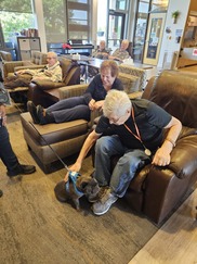 WWVH residents petting a dog