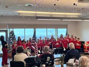 Students performing for residents