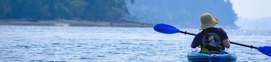 Women in kayak by Sarah Sheedy on Unsplash
