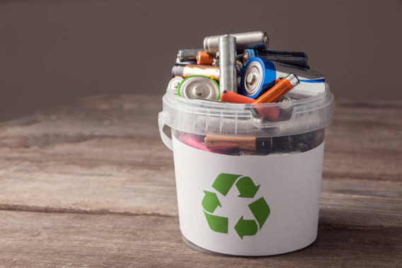 Recycling bucket full of batteries