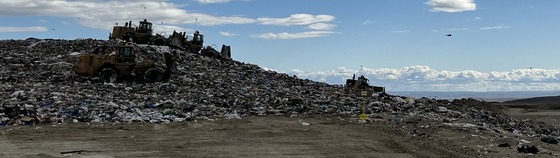 trash pile with tractors