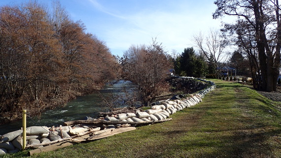Sandbags along a new flooded river