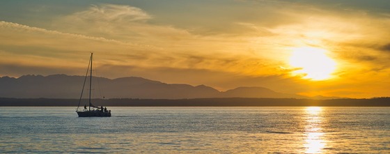 sailboat on puget sound with sunset