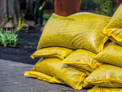 Yellow bags of purchased compost
