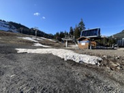 Minimal snow near the ski chairlift.