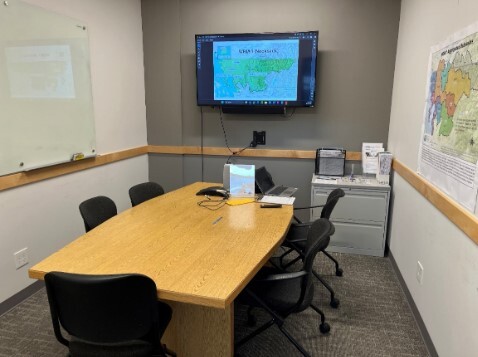 Conference room with Water Resources Inventory Area 1 map displayed on TV screen