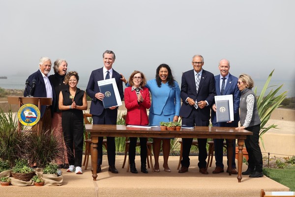 West coast leaders gather after signing a renewed climate commitment as the Pacific Coast Collaborative