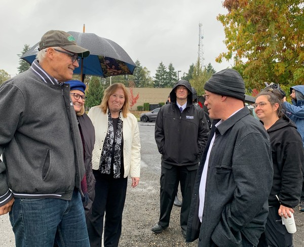 Gov. Jay Inslee tours The Outpost, a pallet shelter community in Vancouver, Wash. 