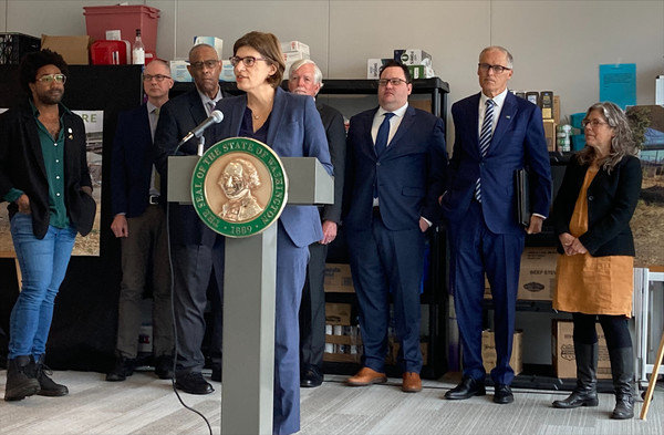 Rep. Nicole Macri speaks after Gov. Jay Inslee previewed his policy agenda for the upcoming legislative session pertaining to housing and homelessness