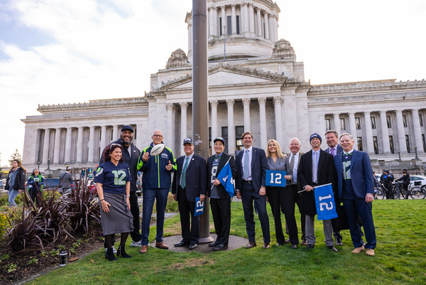 Hall of Famer Walter Jones joined Gov. Jay Inslee, Lt. Gov. Denny Heck, and secretary of state Steve Hobbs to raise the 12 Flag