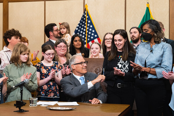 Gov. Jay Inslee signs a bill proclaiming Suciasaurus rex as Washington’s official state dinosaur.