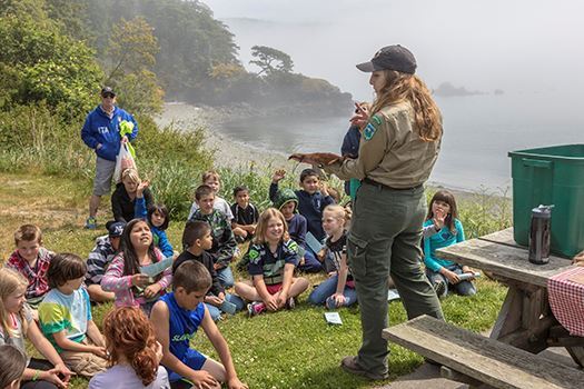 A park ranger reads to kids at Deception Pass State Park