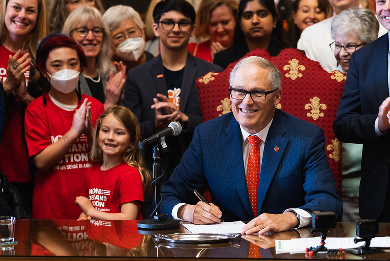 Gov. Jay Inslee signs a bill to ban assault weapons in Washington state.