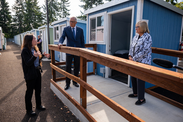 Gov. Jay Inslee and First Spouse Trudi Inslee tour the Franz Anderson Tiny Home Village in Olympia.