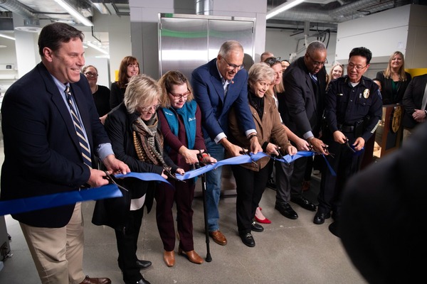 Gov. Jay Inslee snips the ribbon to open the new WSP toxicology lab in Federal Way.