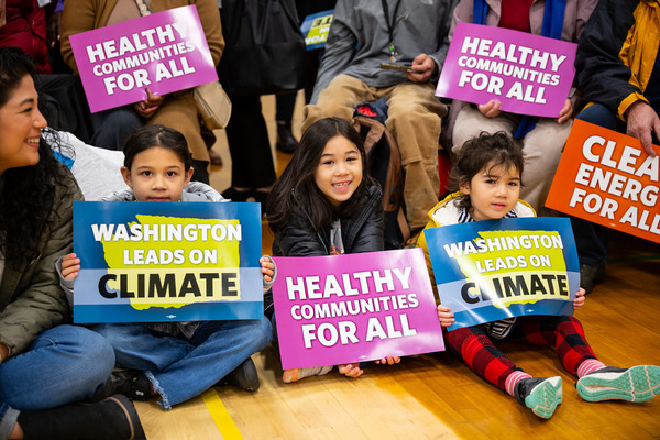 A group of Washington children, who deserve to breathe clean air, hold signs.