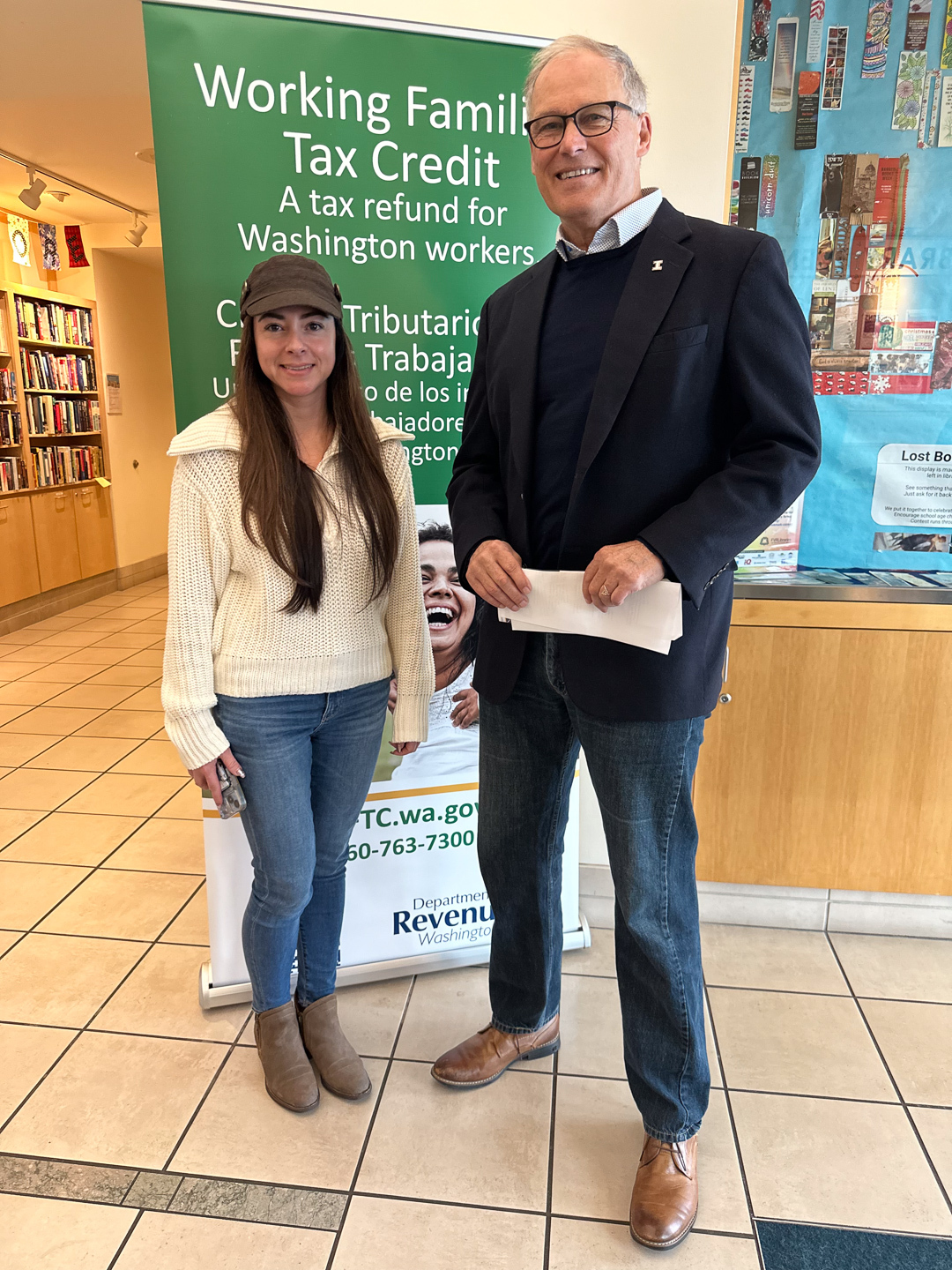 Gov. Jay Inslee poses with WFTC beneficiary Isela Wingfield.