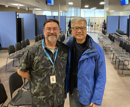 Daniel Gomez standing next to former Governor Gary Locke