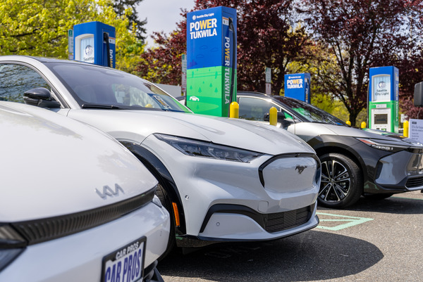 A line of electric vehicles at a charging station