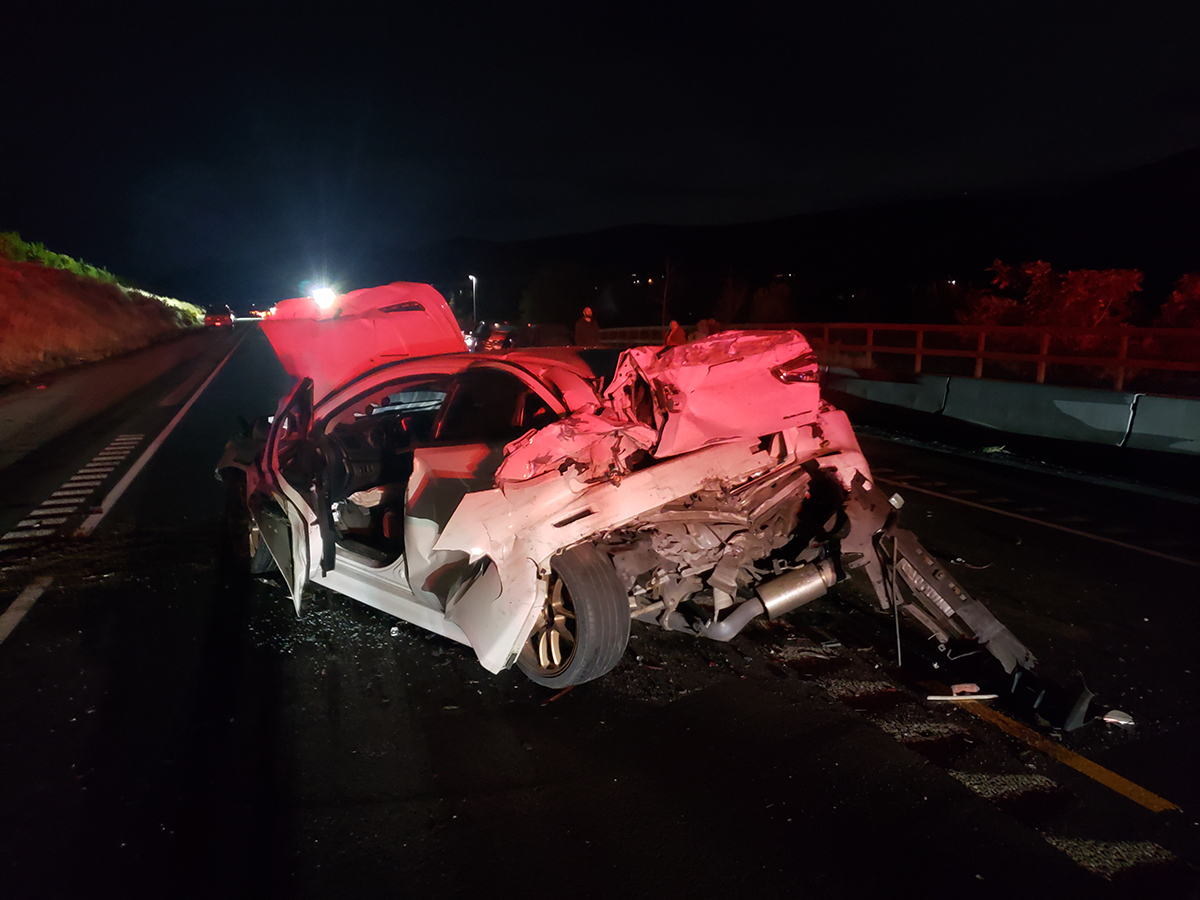 A crumpled, totaled vehicle crashed in a work zone.