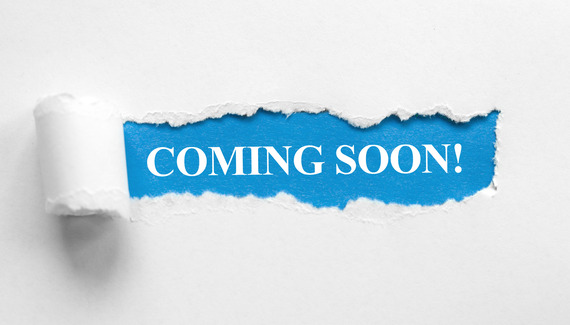 Coming Soon! Text sits on a blue background, with white paper surrounding looking torn around the text.