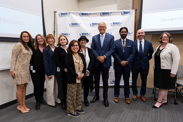 Gov. Jay Inslee poses with the Results Washington team.