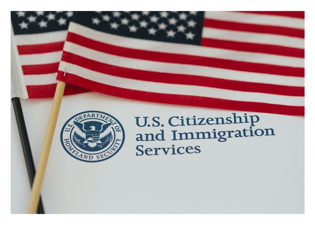 American flag and logo for DHS's U.S. Citizenship and Immigration Services program