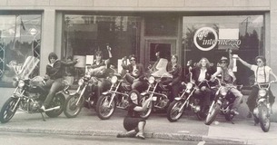 Group posed in front of Olympia’s Cafe Intermezzo