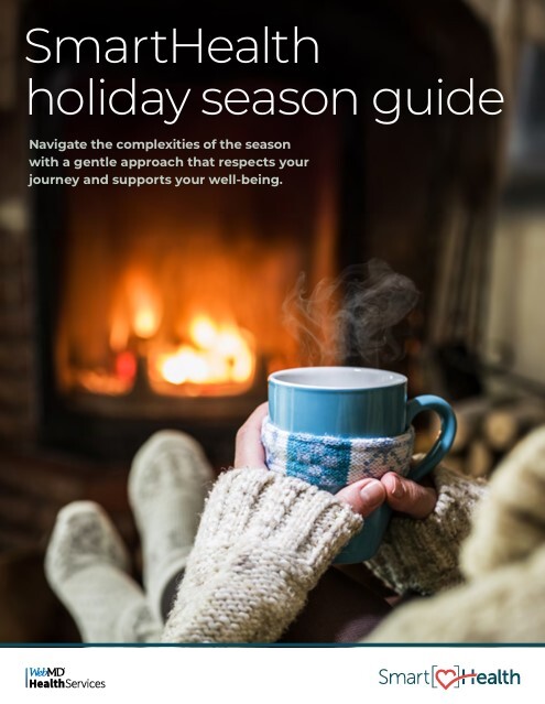 Hands holding a steaming mug of cocoa while sitting in front of a cozy fireplace
