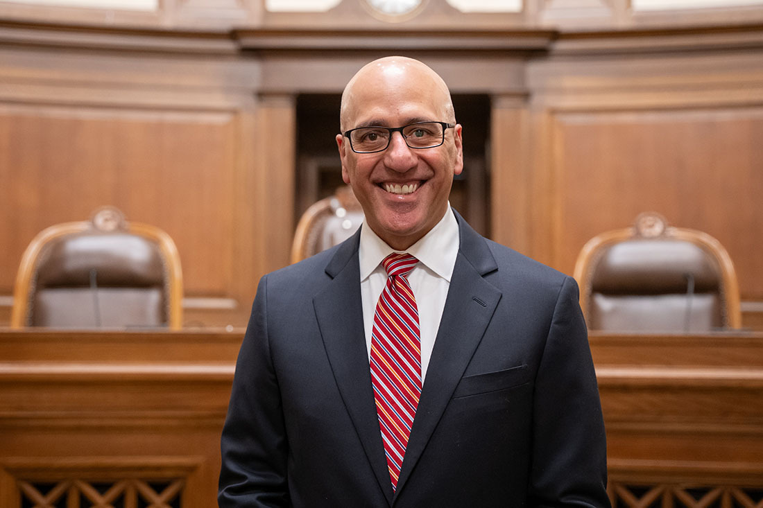 Portrait of Theo Angelis in the Washington State Supreme Court chamber