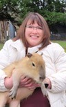 Heidi Helsley holding a capybara