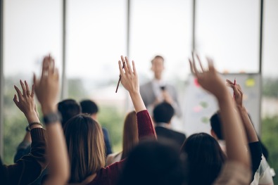 Training attendees raising their hand
