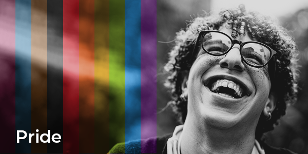 Person smiling and looking up, with the inclusive rainbow with the text "Pride" overlayed