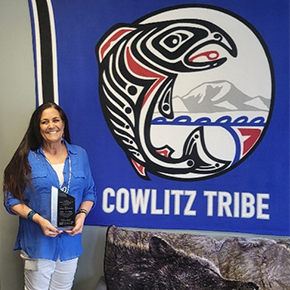 Photo of Rocky Schaffer with Cowlitz Tribe flag