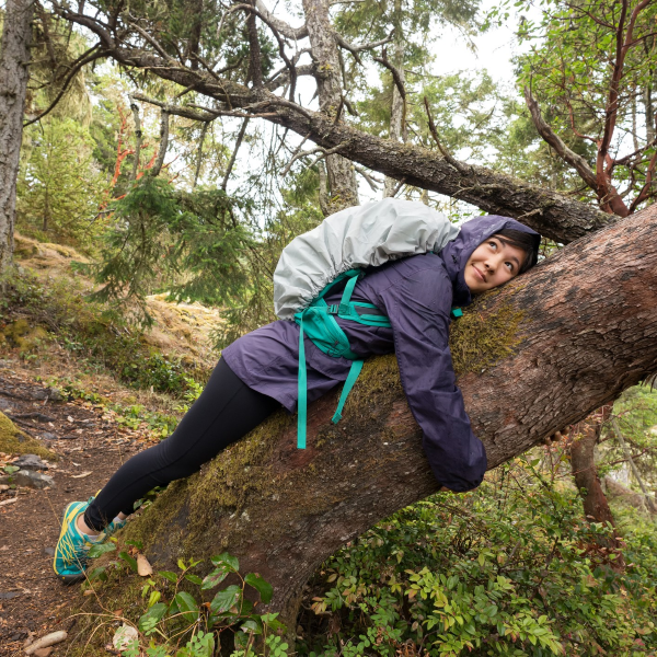 Teen hugging tree