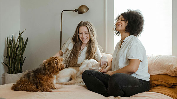 P25 Newsletter: Two young woman, laughing
