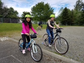 Two kids on small bikes 