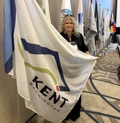 Mayor Ralph poses with City of Kent flag at AWC