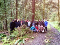 volunteer group behind ivy pile